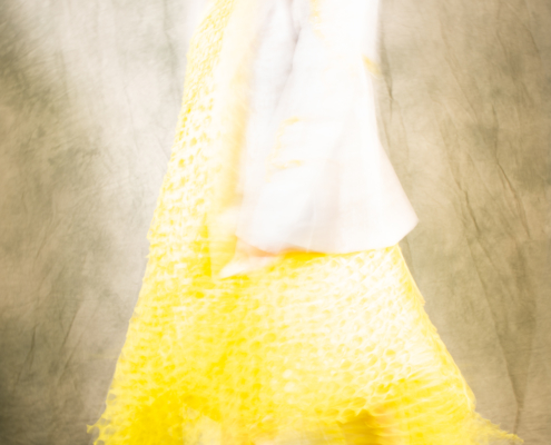 Yellow dress with embroidered jacket in movement - Fashion campaign by Ruud van Ooij