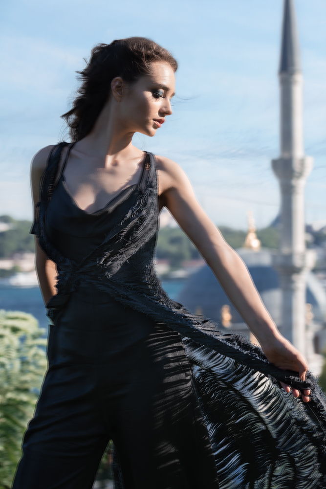 Istanbul fashion editorial black cut coat over black jumpsuit by Ruud van Ooij