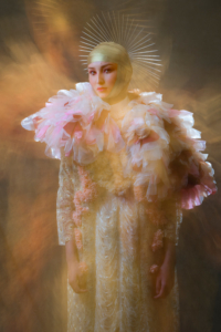 White cut dress with golden jacket and pink petals boa with golden halo - Fashion editorial Ruud van Ooij